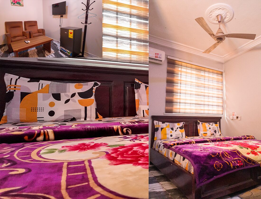 GHS200 room with a queen size bed, air conditioner, TV, fridge and seating